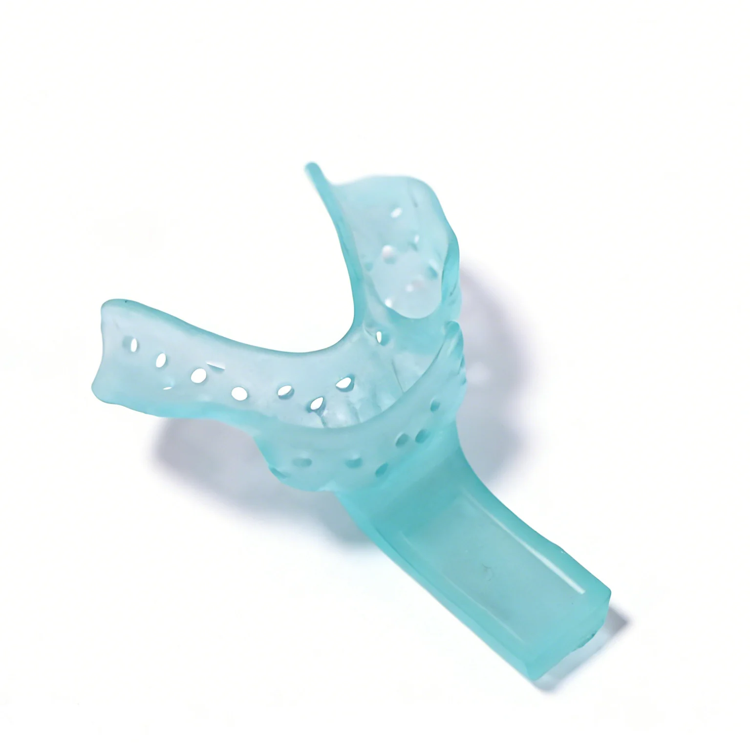 Surgical guides 3D printing verification: a washed, dried and post-cured dental guide on an inspection bench